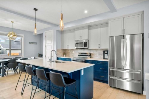 3 Sundown Manor, Cochrane, AB - Indoor Photo Showing Kitchen With Stainless Steel Kitchen With Double Sink With Upgraded Kitchen