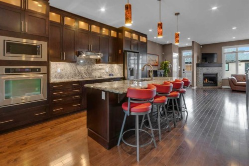 2534 3 Avenue Nw, Calgary, AB - Indoor Photo Showing Kitchen With Fireplace With Stainless Steel Kitchen With Upgraded Kitchen