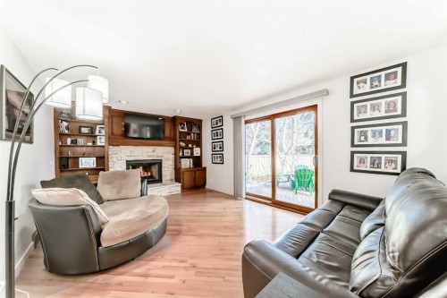17140 Sundown Road Se, Calgary, AB - Indoor Photo Showing Living Room With Fireplace