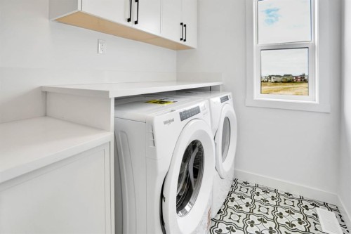 75 Sunvalley Way, Cochrane, AB - Indoor Photo Showing Laundry Room