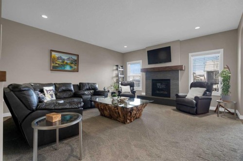 300 Aspenmere Way, Chestermere, AB - Indoor Photo Showing Living Room With Fireplace