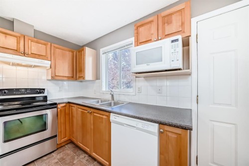 252 Stonemere Place, Chestermere, AB - Indoor Photo Showing Kitchen With Double Sink
