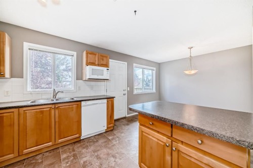 252 Stonemere Place, Chestermere, AB - Indoor Photo Showing Kitchen With Double Sink