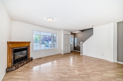 252 Stonemere Place, Chestermere, AB - Indoor Photo Showing Living Room With Fireplace