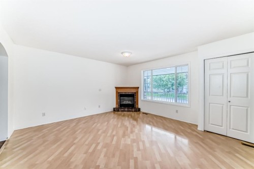 252 Stonemere Place, Chestermere, AB - Indoor Photo Showing Living Room With Fireplace