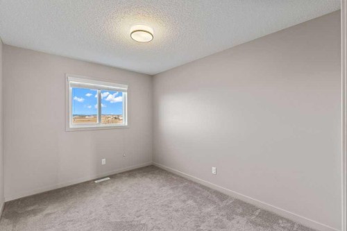 251 Sunrise View, Cochrane, AB - Indoor Photo Showing Other Room