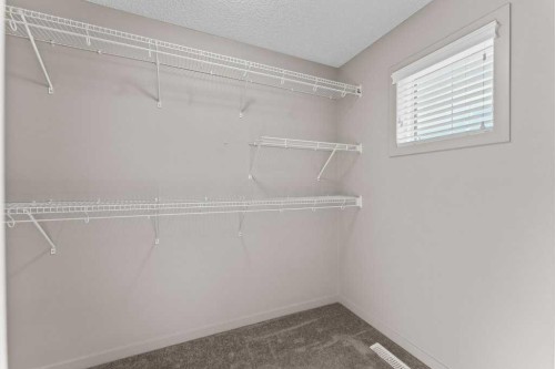 251 Sunrise View, Cochrane, AB - Indoor With Storage