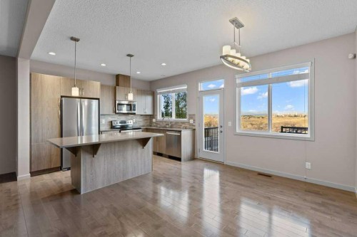 251 Sunrise View, Cochrane, AB - Indoor Photo Showing Kitchen With Upgraded Kitchen