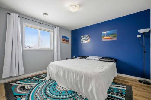 407-8 Bayside Place, Strathmore, AB - Indoor Photo Showing Bedroom