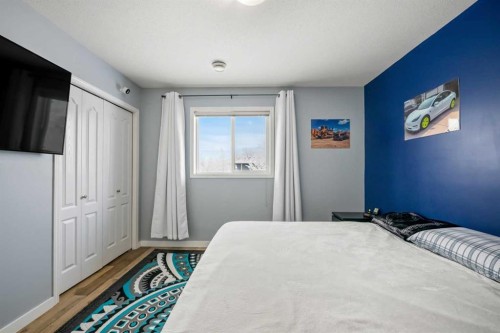 407-8 Bayside Place, Strathmore, AB - Indoor Photo Showing Bedroom