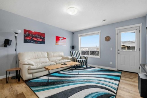 407-8 Bayside Place, Strathmore, AB - Indoor Photo Showing Living Room