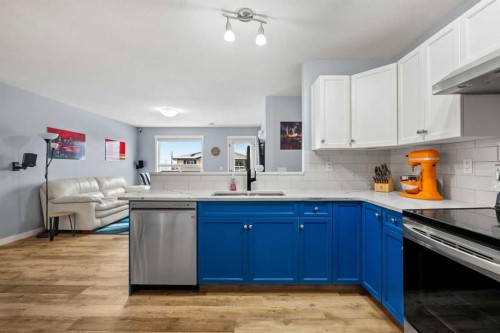 407-8 Bayside Place, Strathmore, AB - Indoor Photo Showing Kitchen With Stainless Steel Kitchen