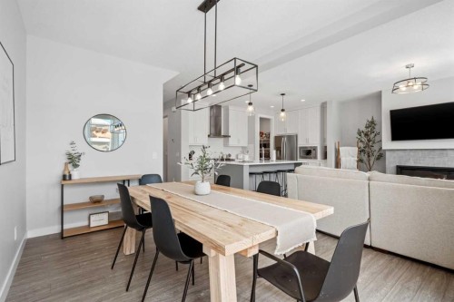 86 Legacy Woods Place Se, Calgary, AB - Indoor Photo Showing Dining Room With Fireplace