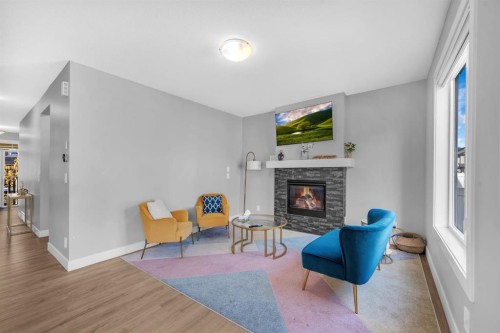 155 Carringham Way Nw, Calgary, AB - Indoor With Fireplace