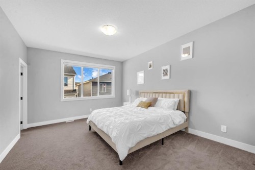 155 Carringham Way Nw, Calgary, AB - Indoor Photo Showing Bedroom