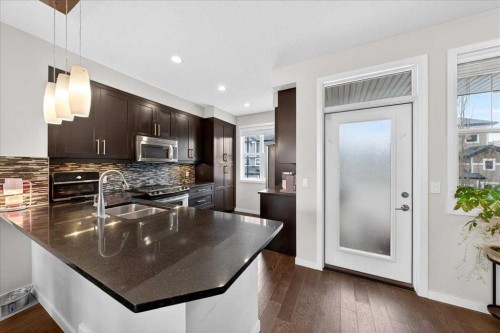 11 Nolan Hill Boulevard Nw, Calgary, AB - Indoor Photo Showing Kitchen With Double Sink With Upgraded Kitchen