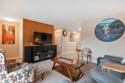 127 Edey Close, Cremona, AB - Indoor Photo Showing Living Room