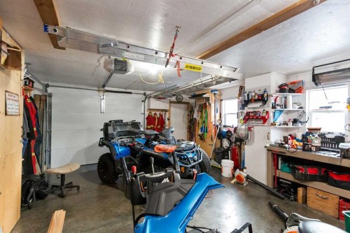 127 Edey Close, Cremona, AB - Indoor Photo Showing Garage