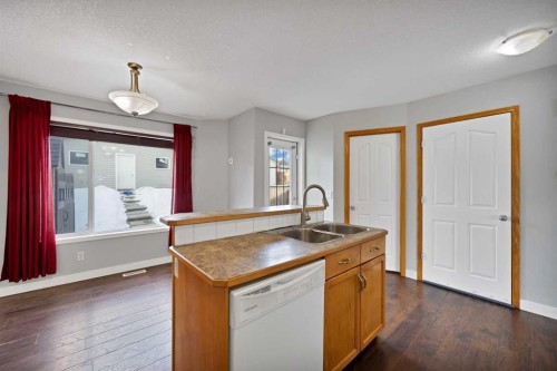 107 Taravista Street Ne, Calgary, AB - Indoor Photo Showing Kitchen With Double Sink