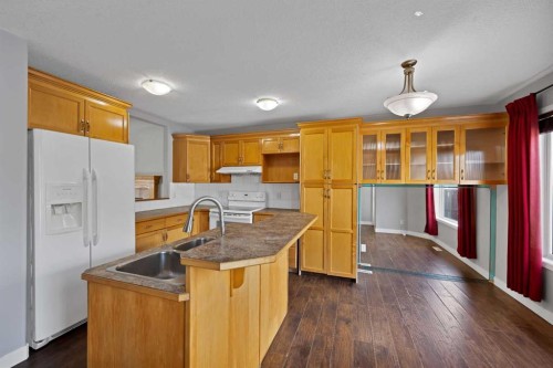 107 Taravista Street Ne, Calgary, AB - Indoor Photo Showing Kitchen With Double Sink
