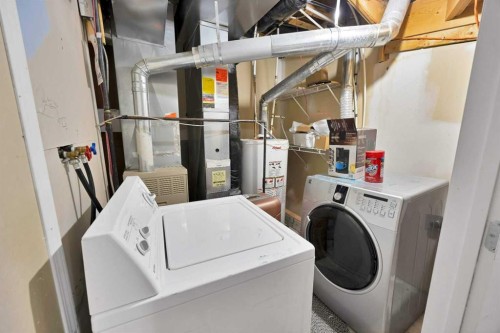 107 Taravista Street Ne, Calgary, AB - Indoor Photo Showing Laundry Room