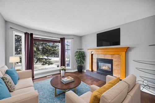 107 Taravista Street Ne, Calgary, AB - Indoor Photo Showing Living Room With Fireplace