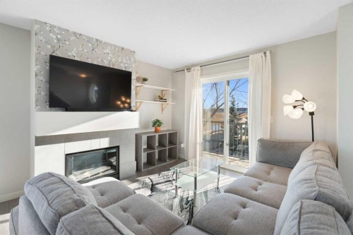 325 Copperpond Landing Se, Calgary, AB - Indoor Photo Showing Living Room With Fireplace