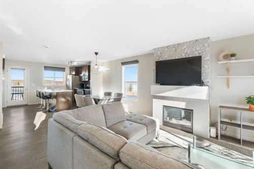 325 Copperpond Landing Se, Calgary, AB - Indoor Photo Showing Living Room With Fireplace