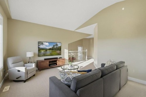 227 Panamount Circle Nw, Calgary, AB - Indoor Photo Showing Living Room