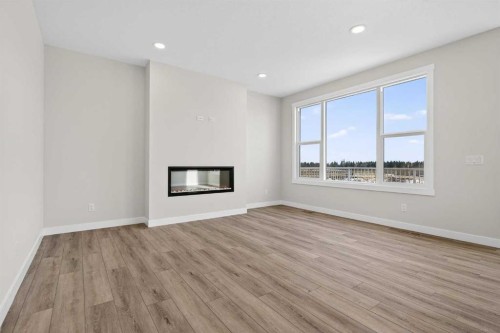 298 Kinniburgh Loop, Chestermere, AB - Indoor Photo Showing Living Room With Fireplace