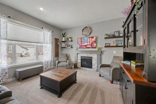 49 Aztec Crescent, Blackfalds, AB - Indoor Photo Showing Living Room With Fireplace