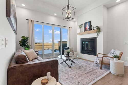 79 Sandpiper Bend, Chestermere, AB - Indoor Photo Showing Living Room With Fireplace