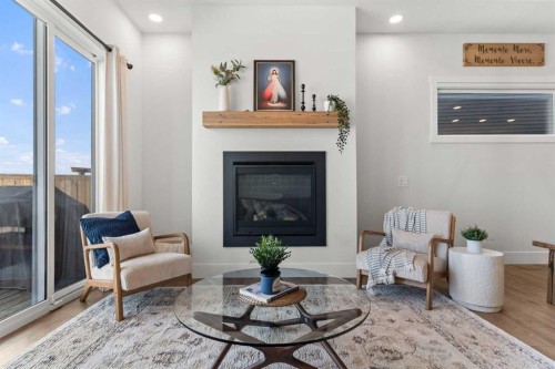 79 Sandpiper Bend, Chestermere, AB - Indoor Photo Showing Living Room With Fireplace