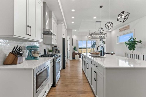 79 Sandpiper Bend, Chestermere, AB - Indoor Photo Showing Kitchen With Double Sink With Upgraded Kitchen