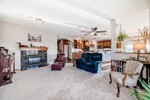 114 Royal Birkdale Crescent Nw, Calgary, AB - Indoor Photo Showing Living Room With Fireplace
