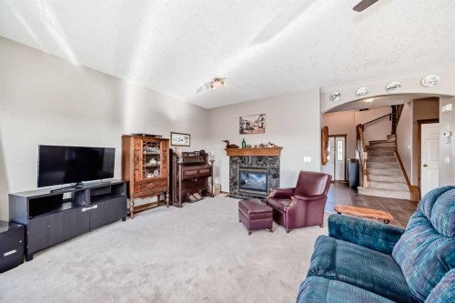 114 Royal Birkdale Crescent Nw, Calgary, AB - Indoor Photo Showing Living Room With Fireplace
