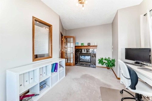 114 Royal Birkdale Crescent Nw, Calgary, AB - Indoor Photo Showing Office With Fireplace