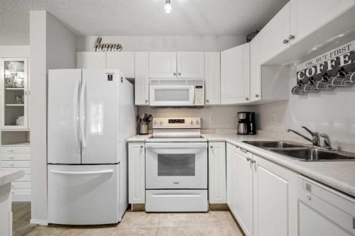 1208 Millrise Point Sw, Calgary, AB - Indoor Photo Showing Kitchen With Double Sink