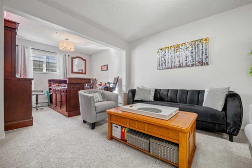 1208 Millrise Point Sw, Calgary, AB - Indoor Photo Showing Living Room