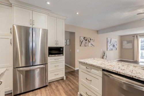 3 Hawkcliff Way Nw, Calgary, AB - Indoor Photo Showing Kitchen With Stainless Steel Kitchen With Upgraded Kitchen