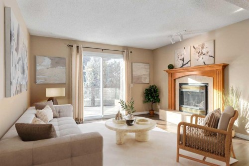 3 Hawkcliff Way Nw, Calgary, AB - Indoor Photo Showing Living Room With Fireplace