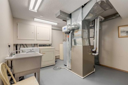 3 Hawkcliff Way Nw, Calgary, AB - Indoor Photo Showing Laundry Room