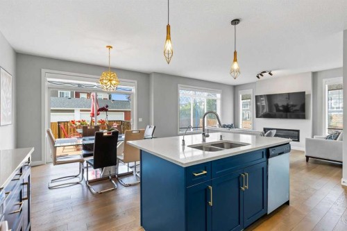 79 Sunrise Way, Cochrane, AB - Indoor Photo Showing Kitchen With Double Sink