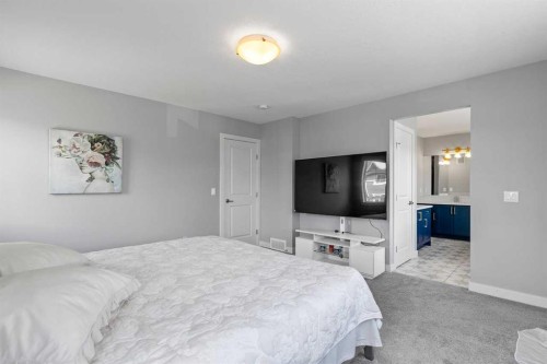 79 Sunrise Way, Cochrane, AB - Indoor Photo Showing Bedroom