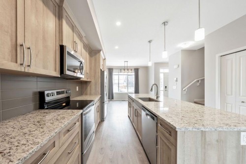 369 D'Arcy Ranch Drive, Okotoks, AB - Indoor Photo Showing Kitchen With Upgraded Kitchen