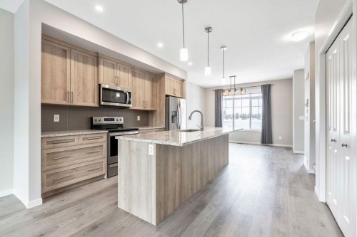 369 D'Arcy Ranch Drive, Okotoks, AB - Indoor Photo Showing Kitchen With Stainless Steel Kitchen With Upgraded Kitchen