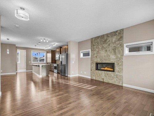 1023 Evanston Drive Nw, Calgary, AB - Indoor Photo Showing Living Room With Fireplace