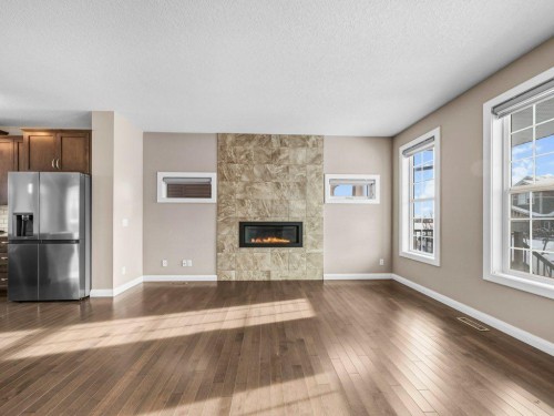 1023 Evanston Drive Nw, Calgary, AB - Indoor Photo Showing Living Room With Fireplace