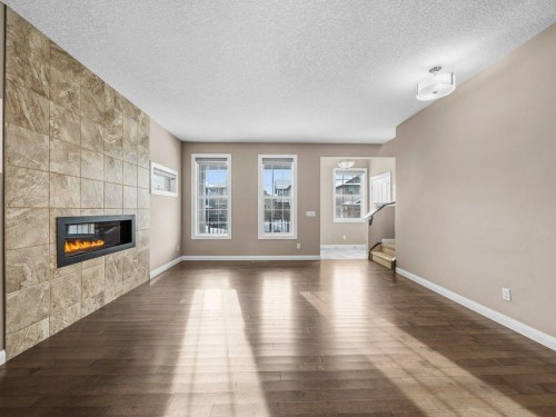 1023 Evanston Drive Nw, Calgary, AB - Indoor Photo Showing Living Room With Fireplace