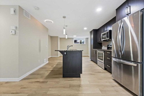 147 Mckenzie Towne Close Se, Calgary, AB - Indoor Photo Showing Kitchen With Stainless Steel Kitchen